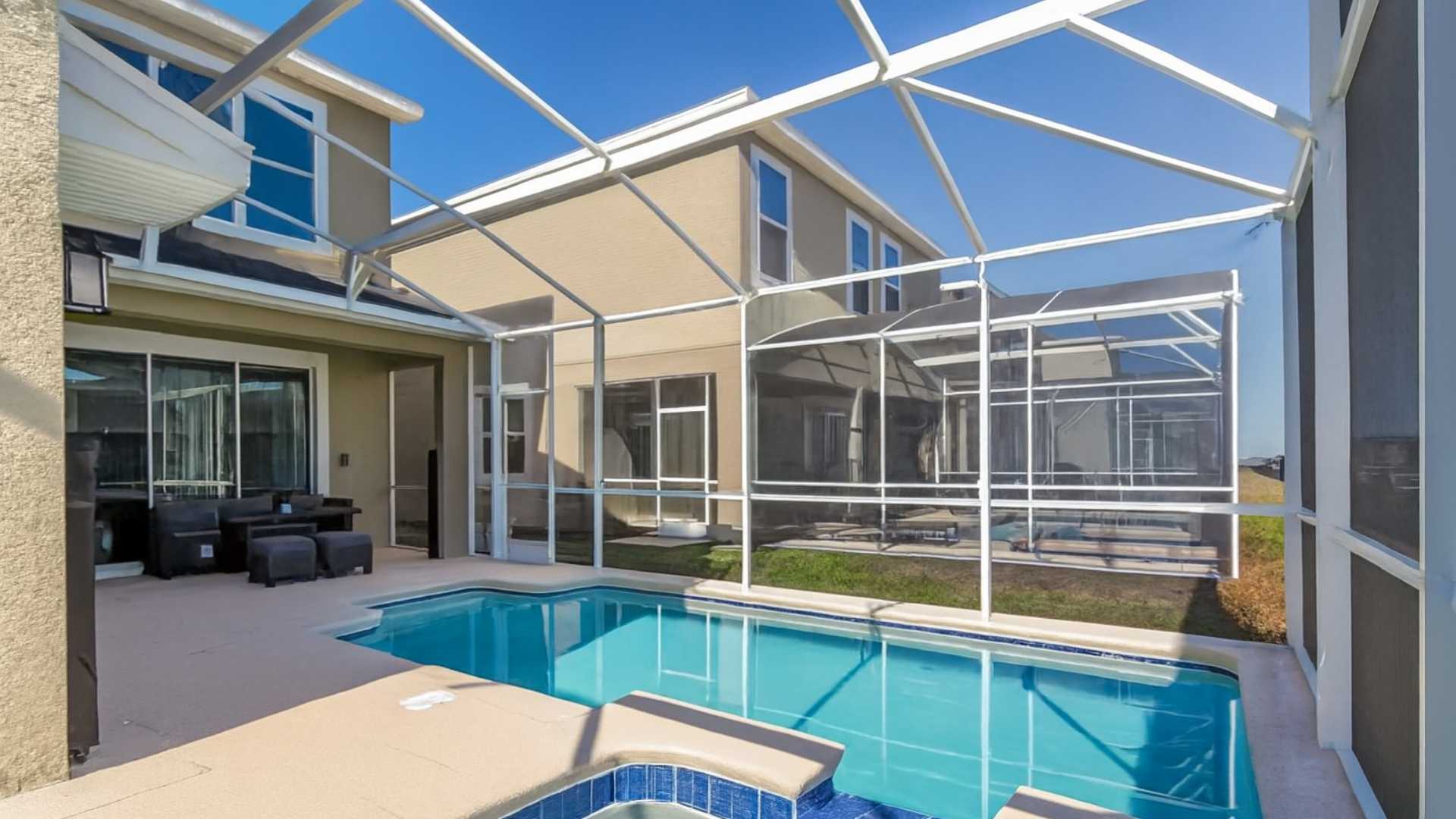 Pool with porch and patio, ideal for enjoying the weather in the Orlando vacation home market.